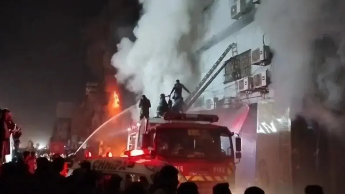Smoke rises from Gul Plaza in central Karachi as firefighters respond to an overnight blaze