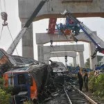 Two killed in crane collapse near Bangkok after train disaster kills 32